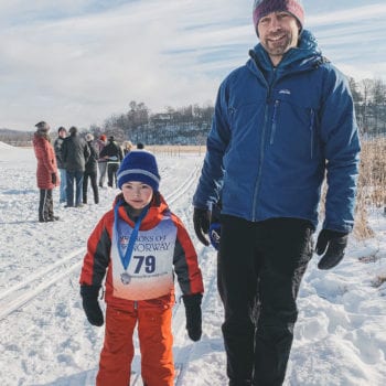 Families enjoy skiing in the Decorah Prairie during Vesterheim and Sons of Norway Barneløpet Children's Ski Event