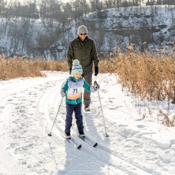 Families enjoy skiing in the Decorah Prairie during Vesterheim and Sons of Norway Barneløpet Children's Ski Event